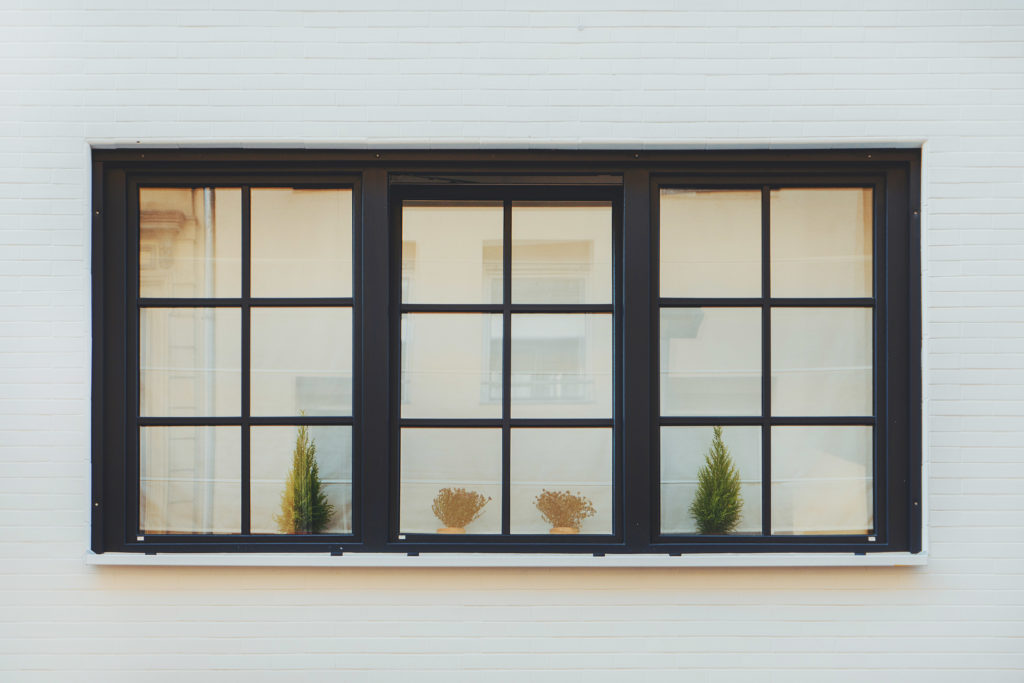 8 Sophisticated Exterior House Colors with Black Windows - Paintzen