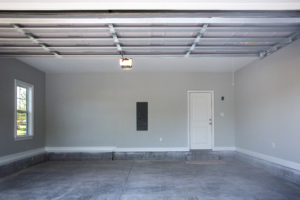 Empty large two-car garage with fresh paint